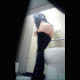 A cute girl is secretly recorded pulling her pants down and sitting on the toilet. She appears to be peeing, but there is no audio. About a minute.